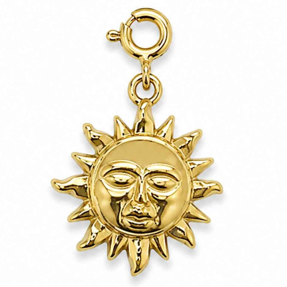 Gold-tone watch charm featuring a radiant sun face design on a white background.