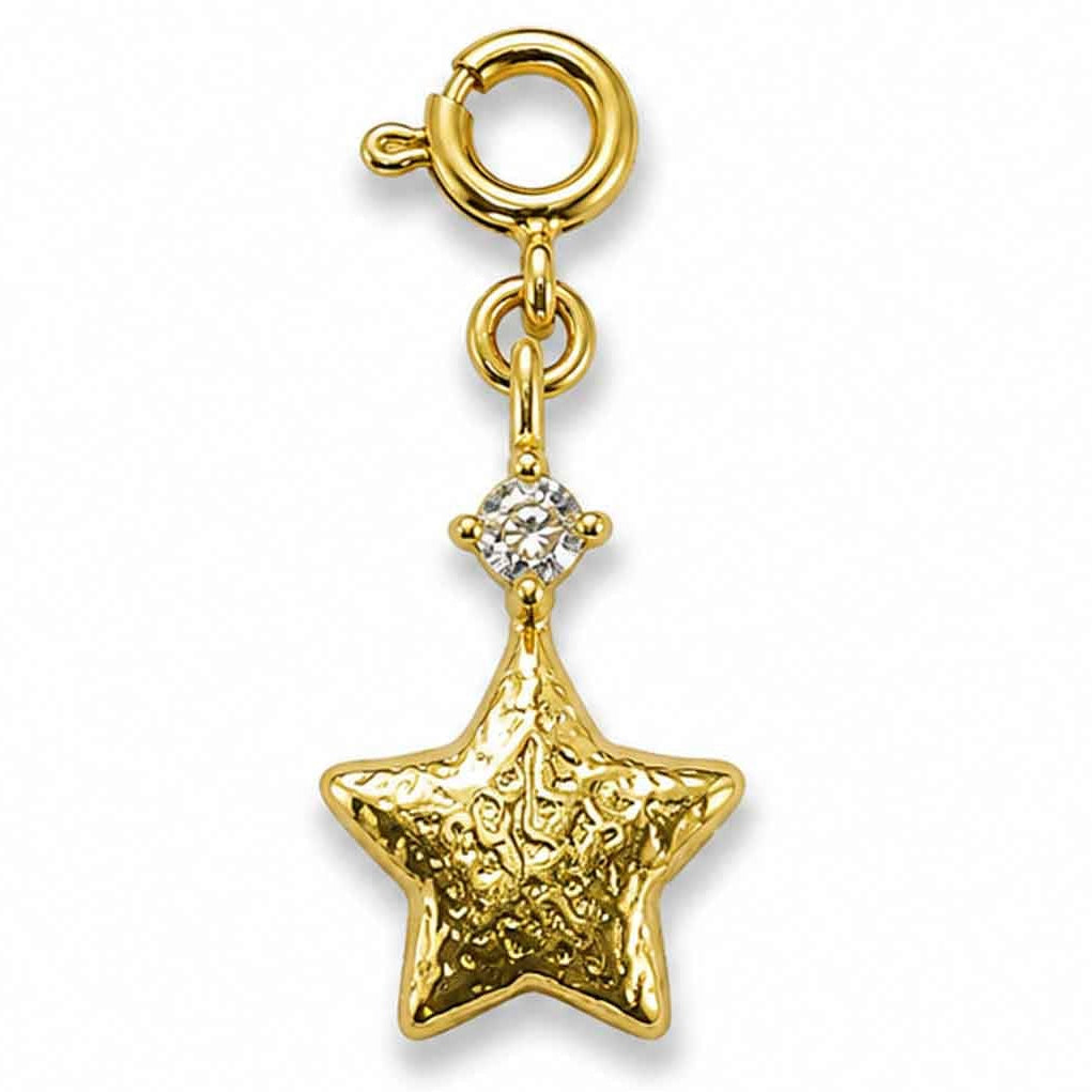Zoomed-out view of a gold-tone star-shaped charm with an engraved textured design and a sparkling stone accent, displayed on a clean white background.