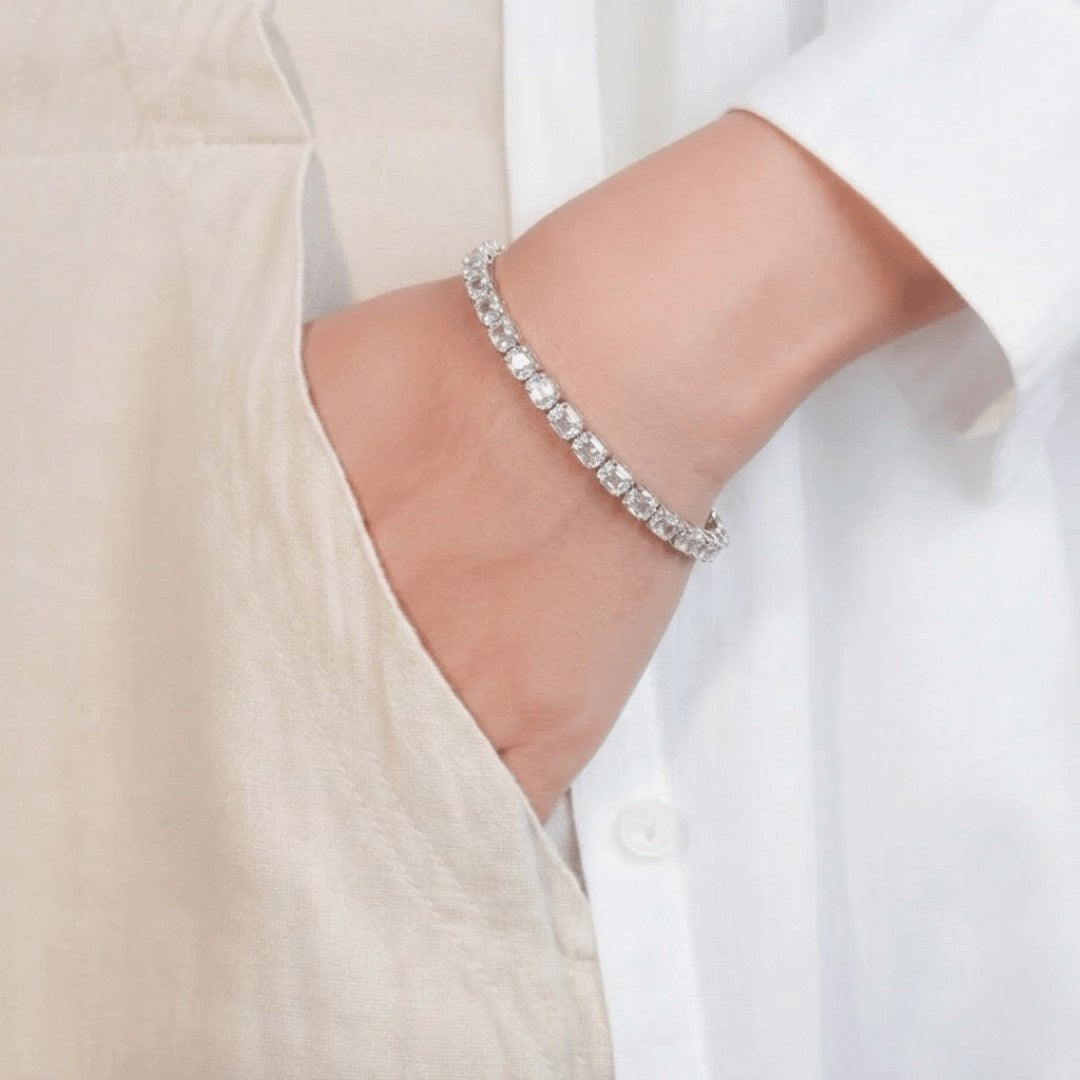 Step cut tennis bracelet with structured link and sleek finish