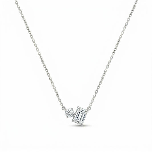 Mixed-Cut Duo Pendant Necklace in Silver Tone with Round and Emerald-Cut Clear Crystal Accents, Displayed on White Background