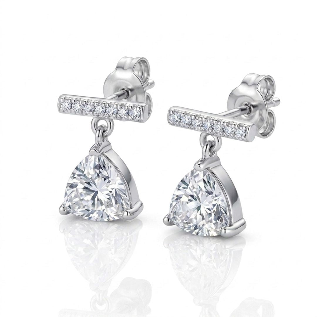 Sterling silver pave bar drop earrings with trillion-cut solitaire stones, worn by a model.