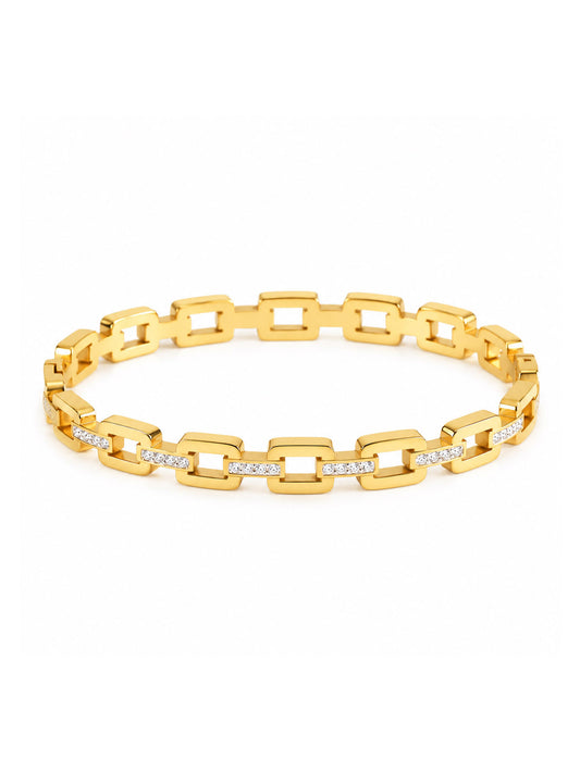 A gold link bangle with a modern rectangular chain-link design and small clear stones set along the front, shown on a plain white background.