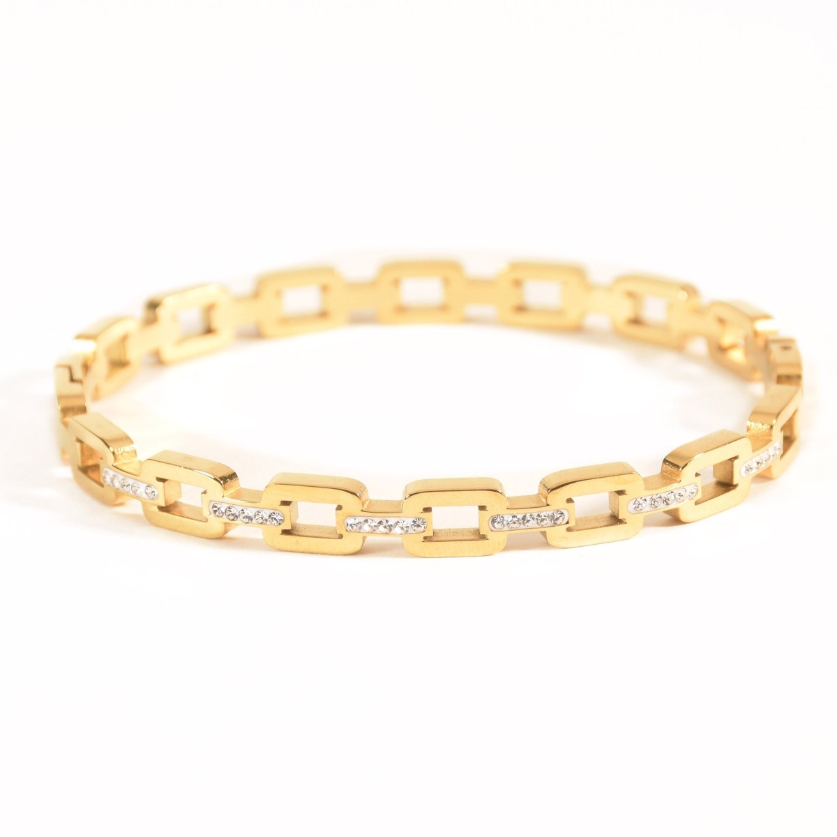 Studded buckle link bangle with sparkling stone detailing and an anti-tarnish finish, available in gold and rose gold, perfect for everyday wear, modern styling, and effortless stacking.