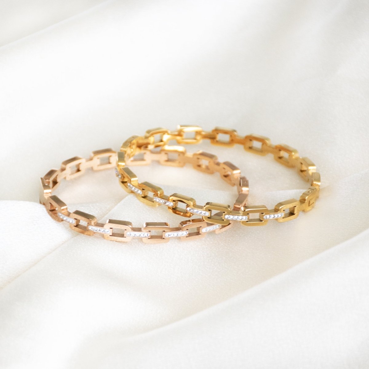 Studded buckle link bangle with sparkling stone detailing and an anti-tarnish finish, available in gold and rose gold, perfect for everyday wear, modern styling, and effortless stacking.