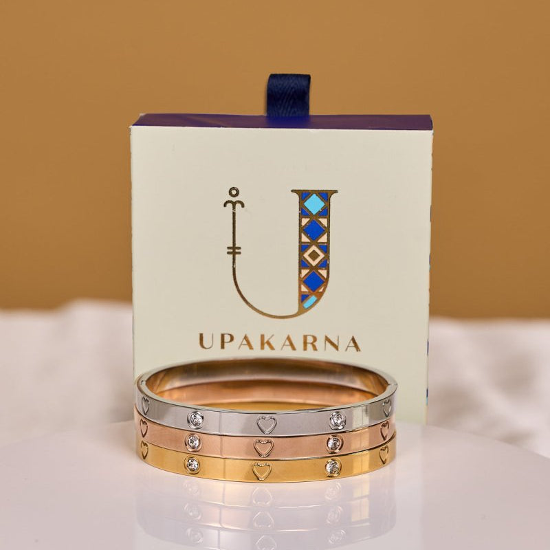 Elegant heart-studded bangles with sparkling detailing and an anti-tarnish finish, available in golden, rosegold, and silver, perfect for everyday wear, gifting, and chic stacked styling.