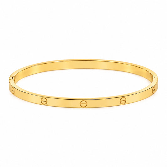 Gold anti-tarnish bangle with a slim polished band and engraved screw designs, displayed on a clean white background.