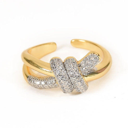 Elegant golden knot ring with sparkling pavé detailing and an adjustable anti-tarnish finish, perfect for everyday elegance, stacking, and timeless styling.
