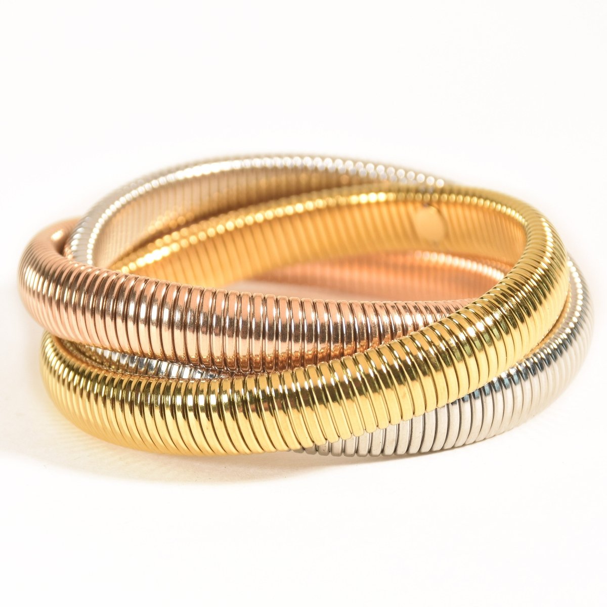 Stylish triple-layer twisted bangle with mixed metallic tones and an anti-tarnish finish, perfect for trendy everyday styling, statement looks, and versatile stacking.
