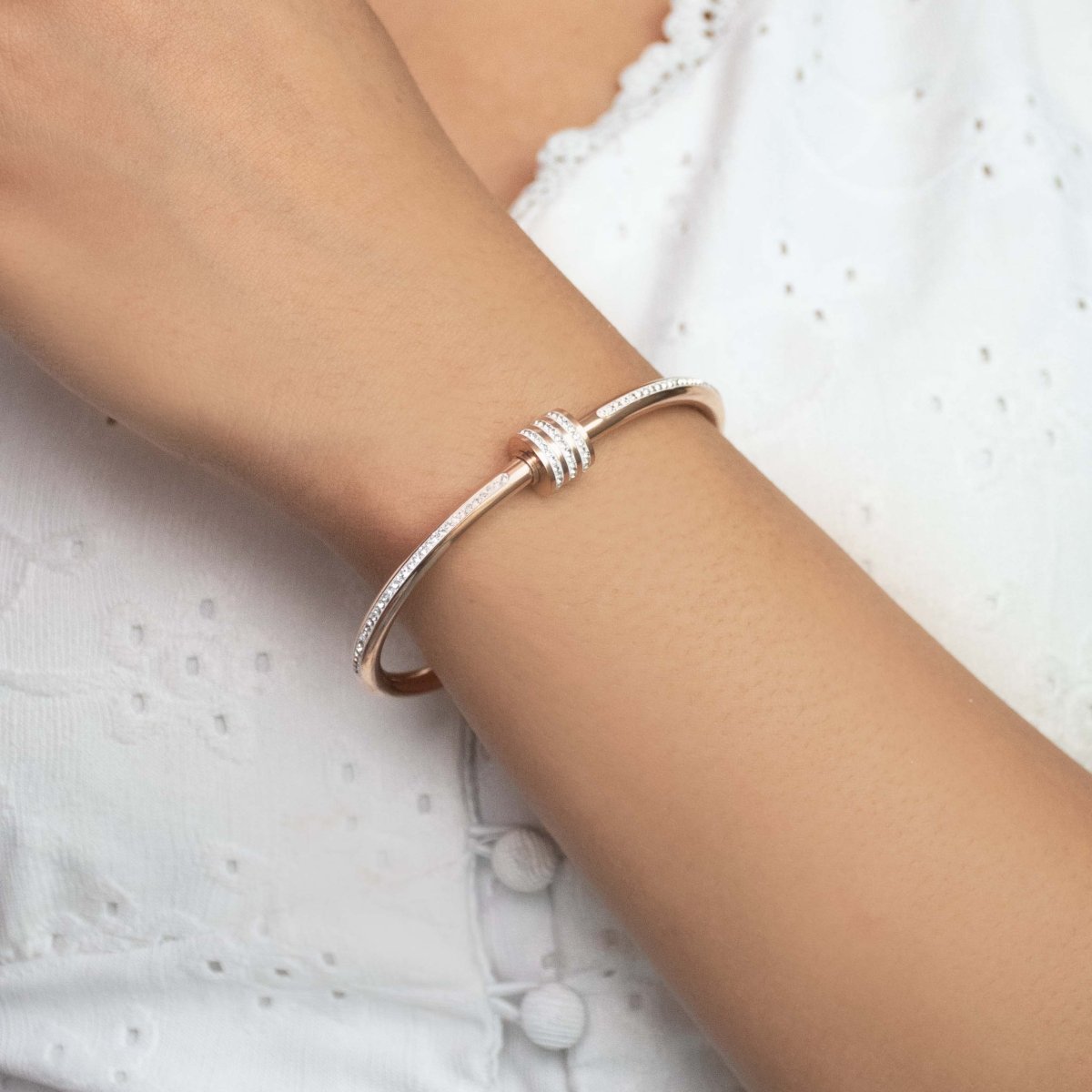 Elegant rosegold twisted sparkle bangle with shimmering stone detailing and an anti-tarnish finish, perfect for everyday glam, casual styling, gifting, and chic layered looks.