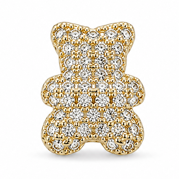 Gold teddy bear jewellery charm embellished with multiple clear crystal stones on a white background.
