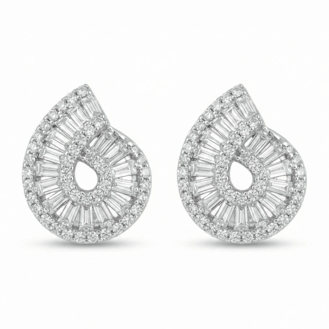 Diamond swirl studs with baguette and round crystal detailing and an anti-tarnish silver finish, perfect for everyday wear and elegant styling.