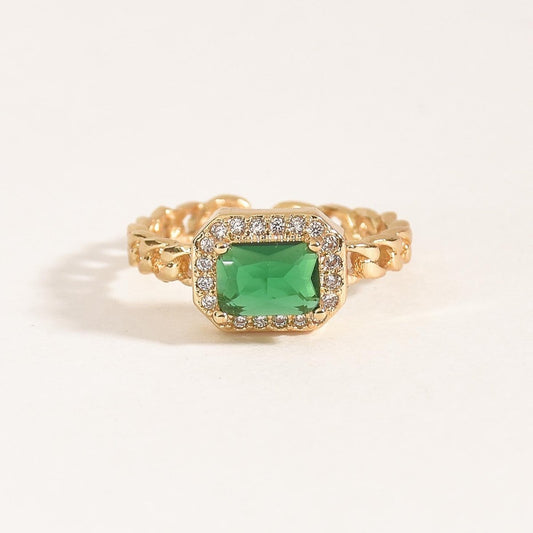 Emerald stone ring with a halo of sparkling crystal accents and an anti-tarnish gold finish, perfect for everyday wear, elegant styling, and statement looks.