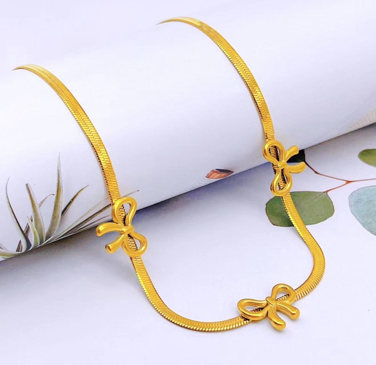 Gold Bow Necklace - Upakarnaproduct_type