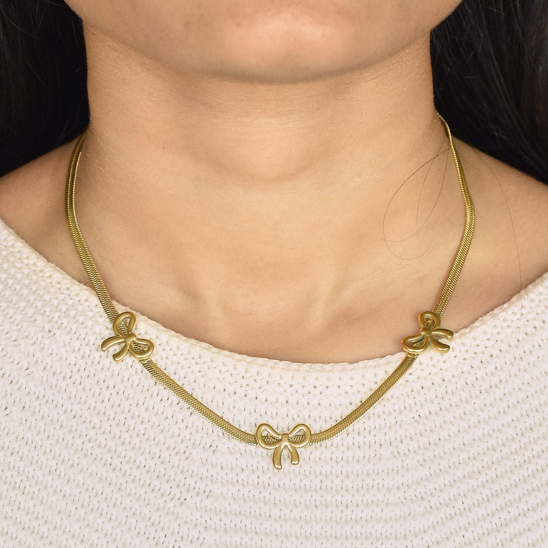 Gold Bow Necklace - Upakarnaproduct_type