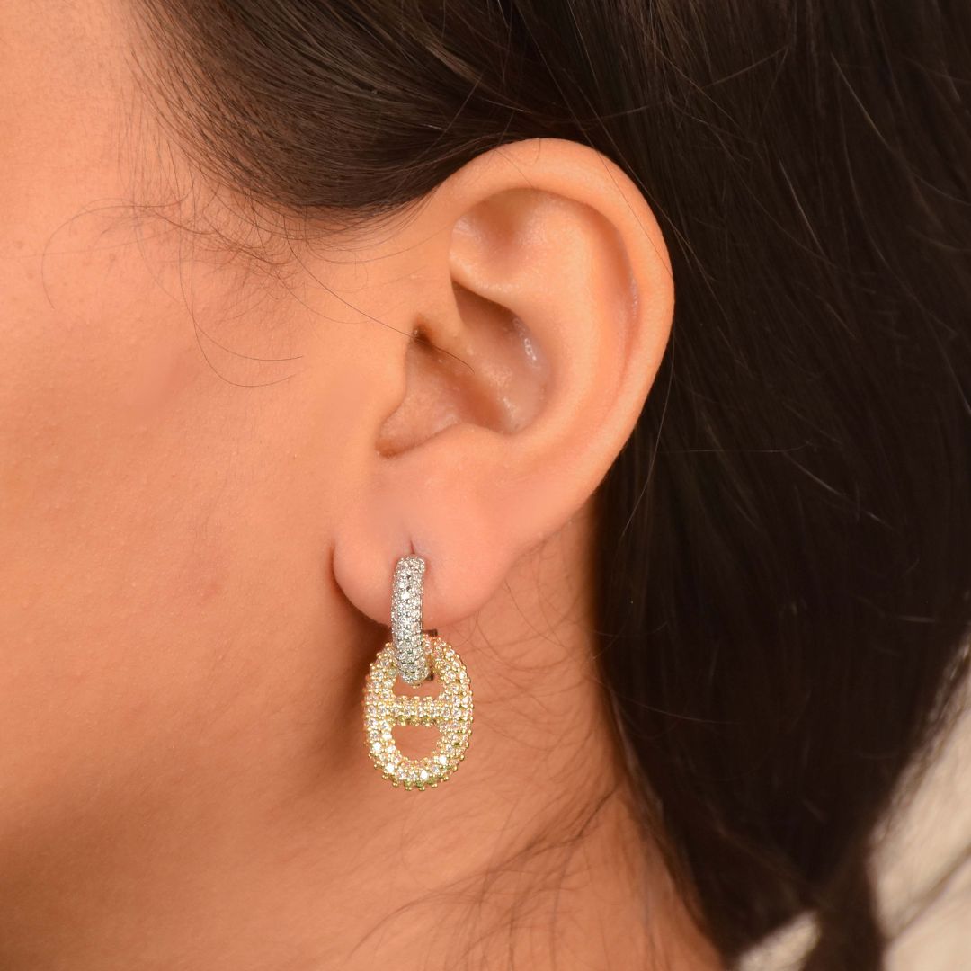 Interlock glam earrings with pavé crystal detailing and an anti-tarnish gold finish, perfect for everyday wear and elegant styling.