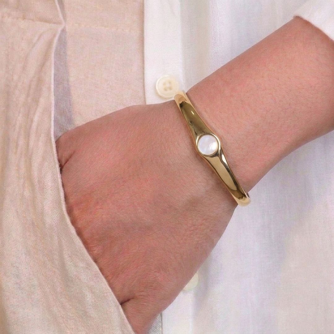 Minimalist inlay bangle with a sleek circular accent and an anti-tarnish gold finish, perfect for everyday wear, elegant styling, and effortless layering.
