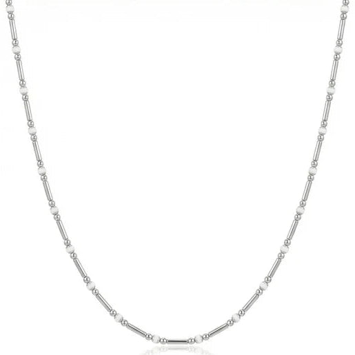 Silver-tone delicate necklace featuring a fine chain with evenly spaced small round bead and tube-like accents, arranged in a simple U-shaped curve on a white background.