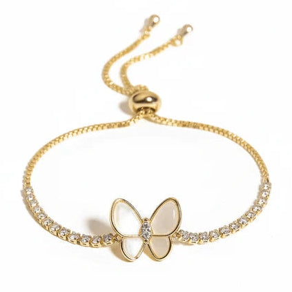 Gold-tone adjustable bracelet featuring a delicate butterfly centerpiece with a small clear crystal, paired with crystal-studded sections along the chain.