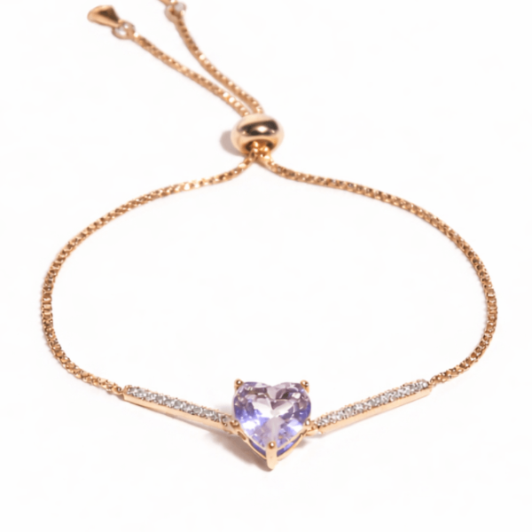 Pink heart bracelet with a heart-shaped crystal centerpiece and an anti-tarnish finish, perfect for everyday wear and elegant styling.