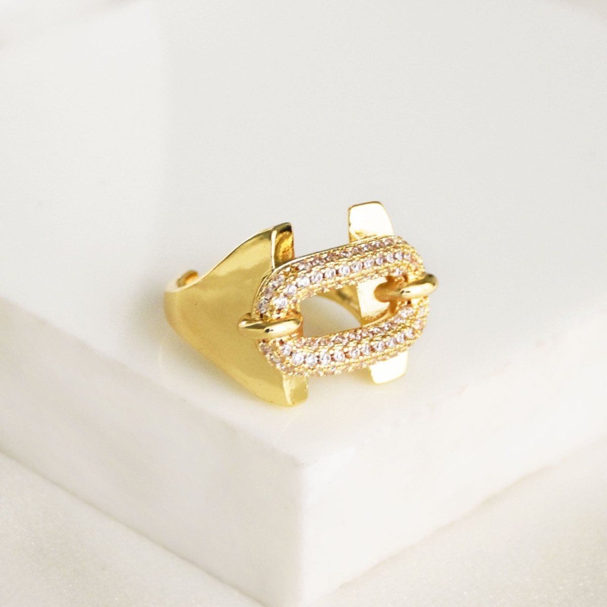 Studded buckle ring with sparkling crystal accents and link-inspired detailing, finished with an anti-tarnish gold coating, perfect for everyday wear, statement styling, and thoughtful gifting.
