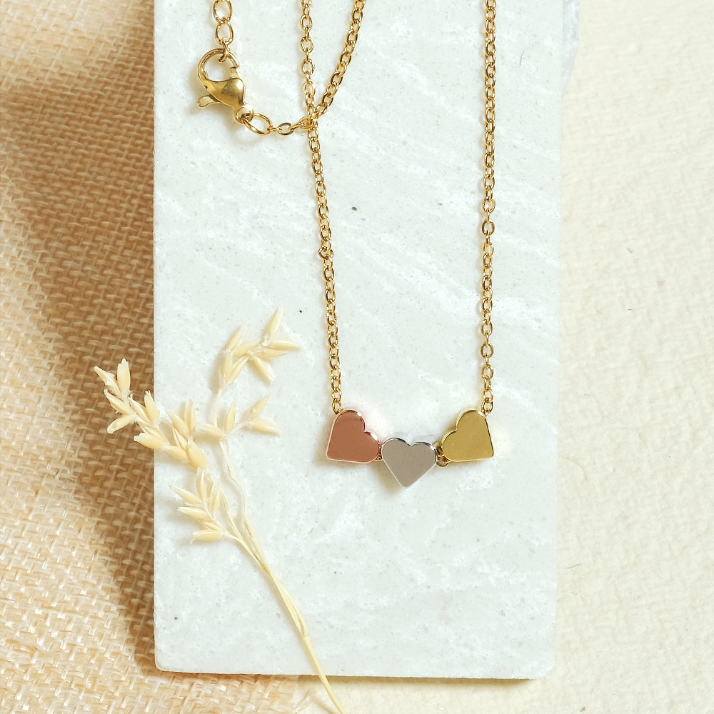 Triple heart gold on sale necklace