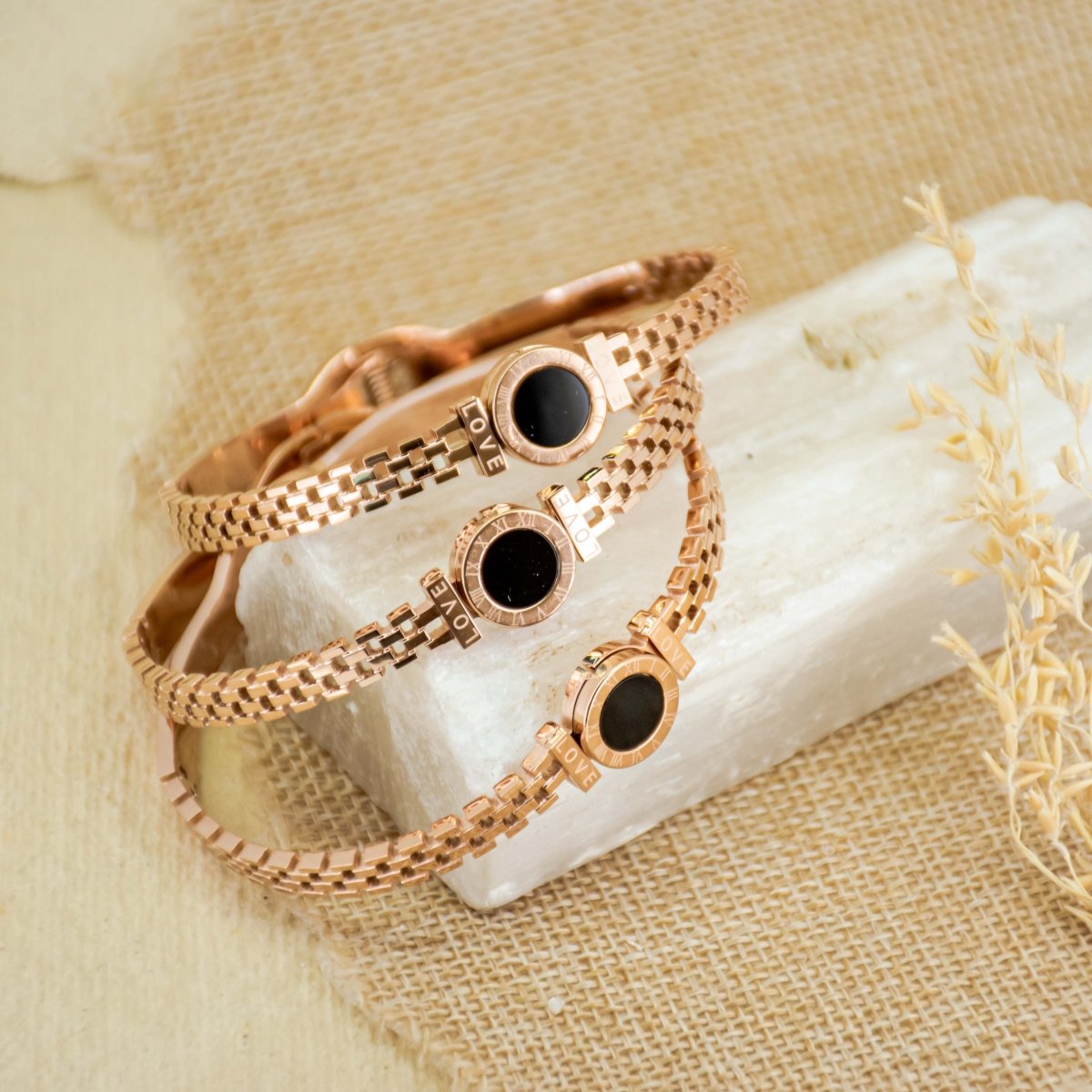 Elegant Roman-style bangle with black detailing and an anti-tarnish finish, available in golden and rosegold, perfect for everyday luxury and chic versatile styling.