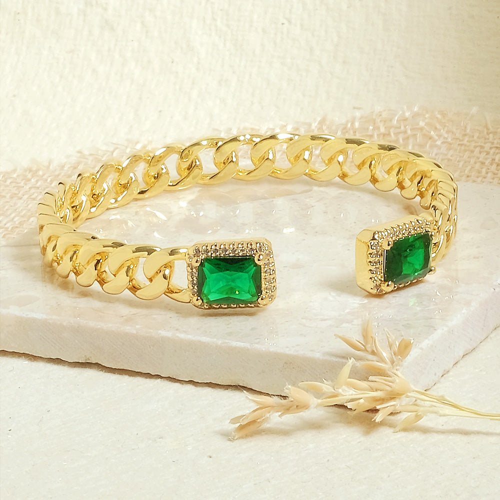 Elegant golden emerald loop bangle with a chic chain-link design and adjustable anti-tarnish finish, perfect for everyday elegance, special occasions, and stylish stacked looks.