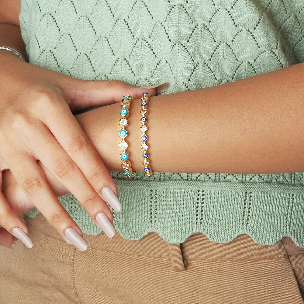 Stylish evil eye cuff bangles crafted in stainless steel with an adjustable design, available in black, blue, red, white, green, and rainbow shades, perfect for everyday wear and trendy protective styling.