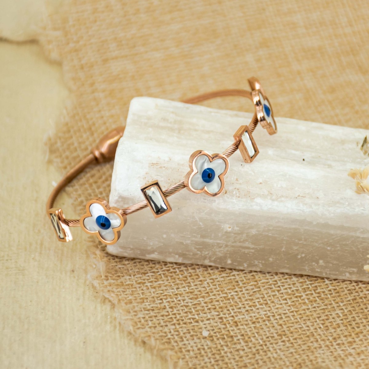 Elegant rosegold flower bangle with mother-of-pearl detailing, a secure magnetic lock, and an anti-tarnish finish, perfect for everyday chic styling and effortless elegance