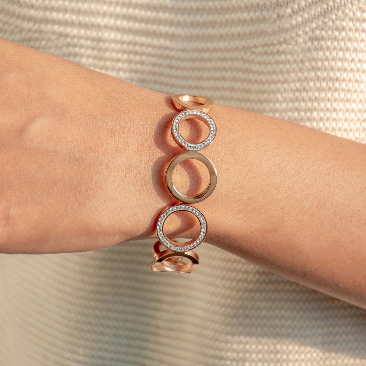 Elegant rosegold multi-ring bangle with sparkling stone detailing and an anti-tarnish finish, perfect for brunch dates, party looks, and chic everyday styling.