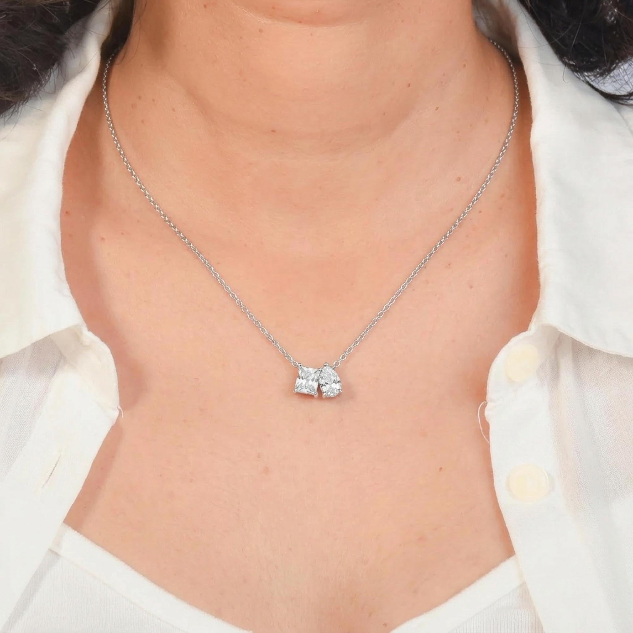 Crystal Pair 925 sterling silver necklace featuring a princess-cut crystal and pear-cut crystal pendant duo suspended from a delicate silver chain