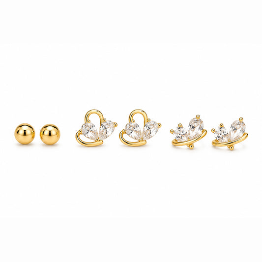 Zoomed-out view of gold-tone ball stud earrings and butterfly earrings with clear crystal details, displayed on a clean white background.
