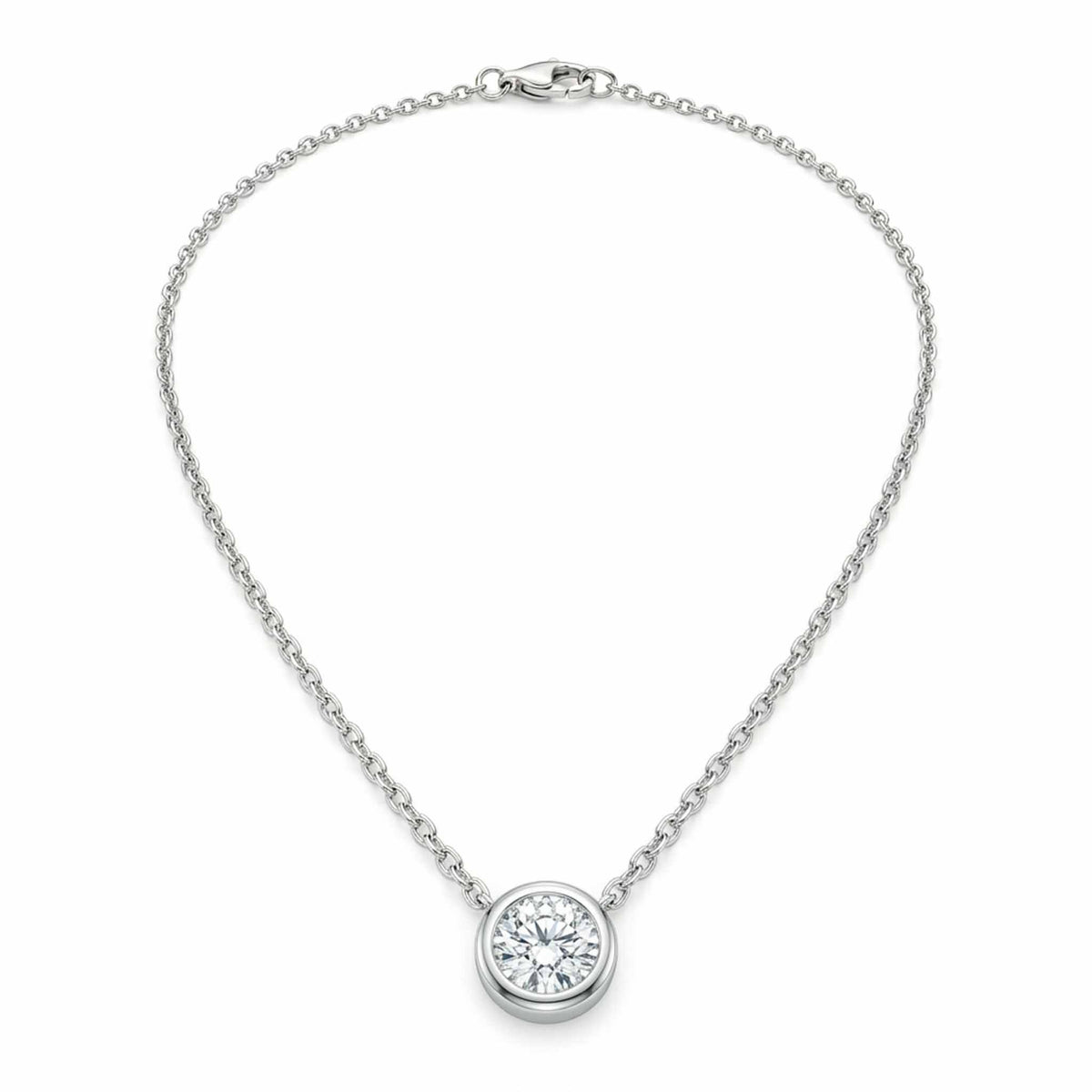Silver solitaire pendant necklace featuring a round-cut crystal in a bezel setting on a delicate chain, displayed on a white background