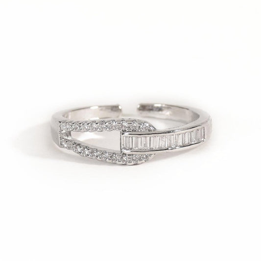 Elegant silver interlocked ring featuring baguette crystals, pavé detailing, and an anti-tarnish finish, perfect for modern styling, statement looks, and everyday sophistication.
