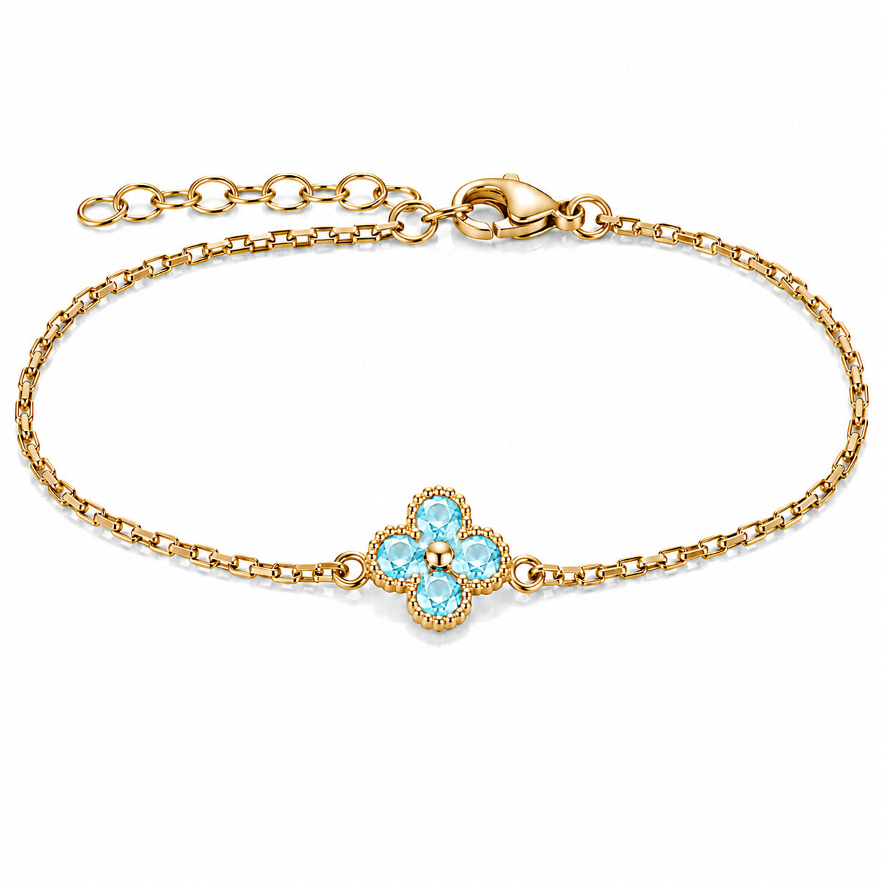 Gold-tone bracelet featuring a sky blue four-petal flower charm with faceted stones, a delicate link chain, and an adjustable clasp on a white background.