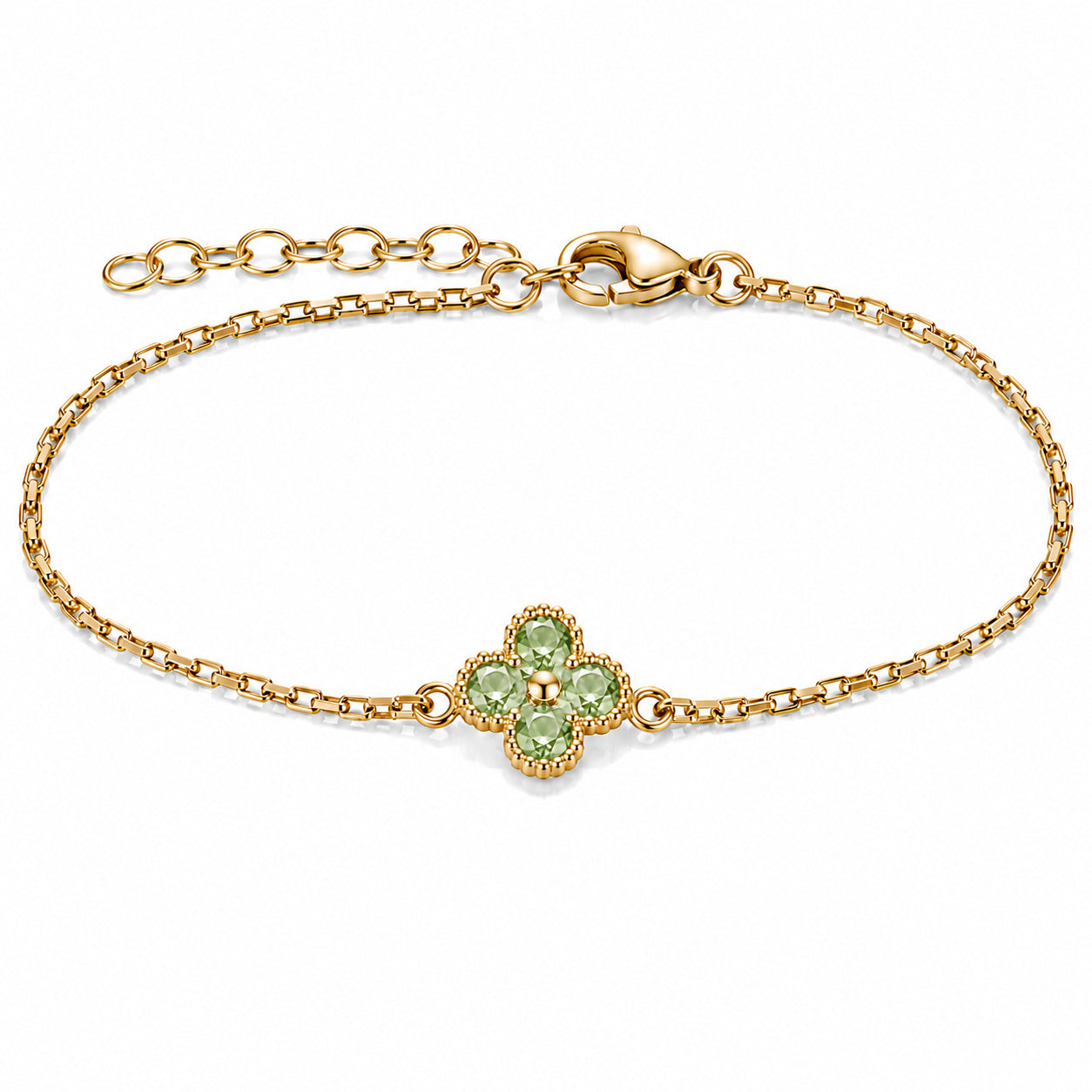 Gold-tone bracelet featuring a light green four-petal flower charm with faceted stones, a delicate link chain, and an adjustable clasp on a white background.