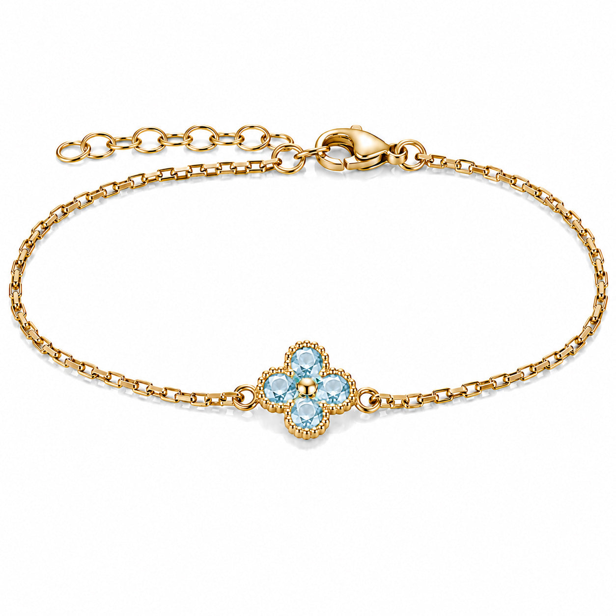 Gold-tone bracelet featuring a light blue four-petal flower charm with faceted stones, a delicate link chain, and an adjustable clasp on a white background.