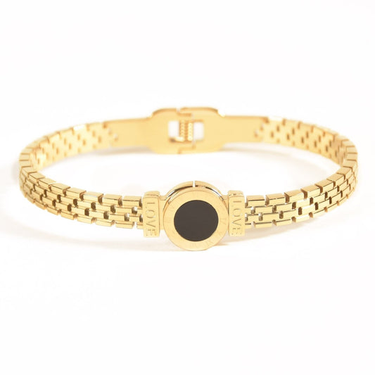 Elegant Roman-style bangle with black detailing and an anti-tarnish finish, available in golden and rosegold, perfect for everyday luxury and chic versatile styling.
