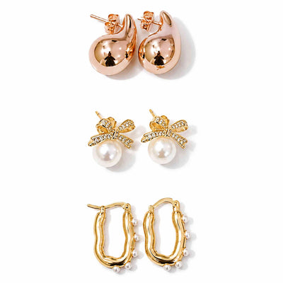 Gold, rose gold and pearl earring stack featuring teardrop studs, pearl bow earrings and pearl-lined hoops on a clean white background.