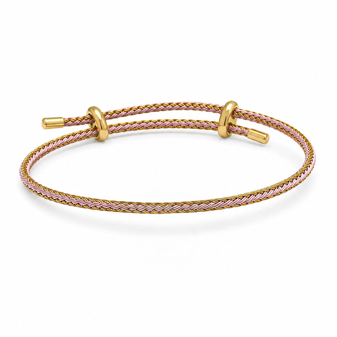 Braided pink and gold-tone cord bracelet with gold-tone sliding rings and end caps on a white background.