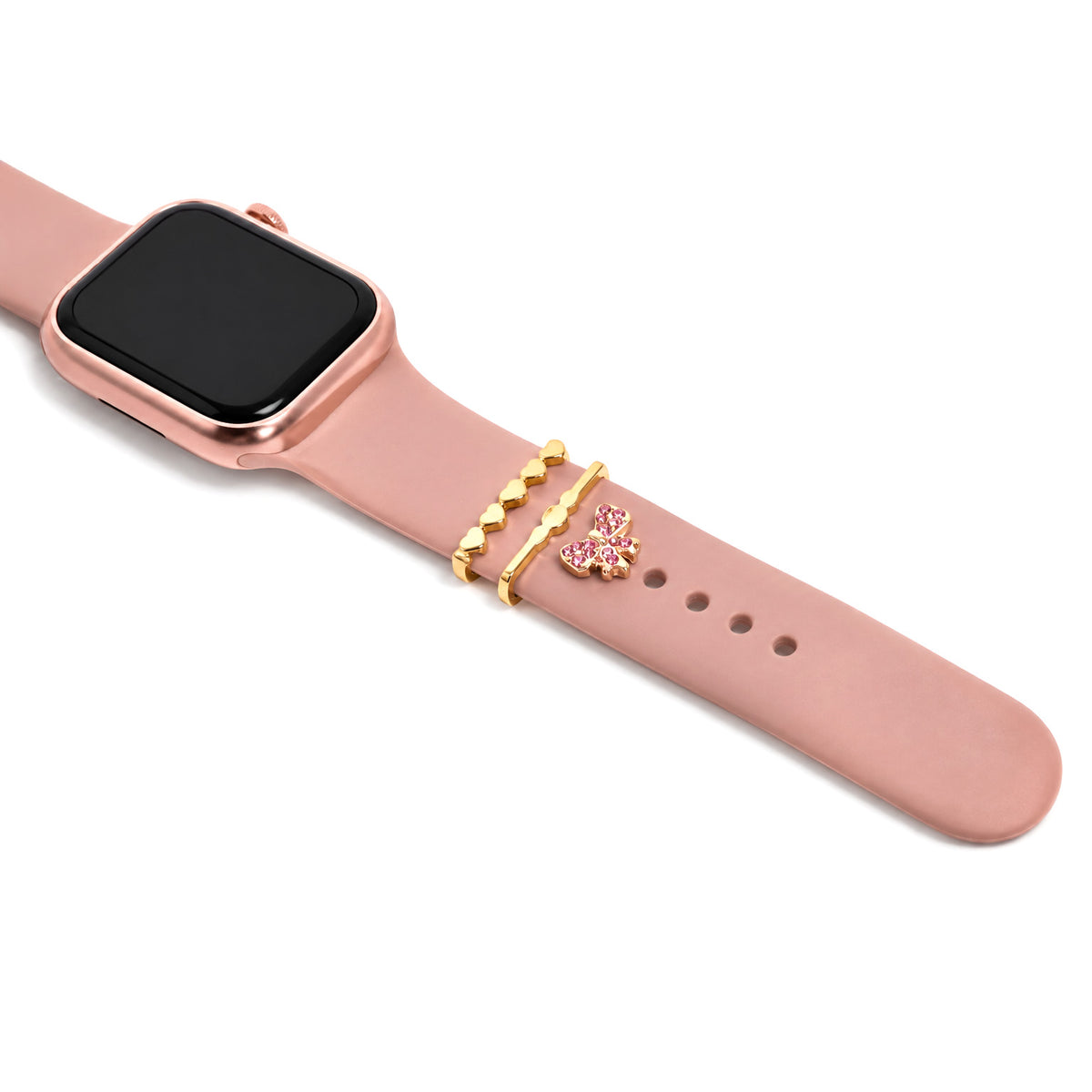 Zoomed-out view of a pink smartwatch decorated with gold heart-shaped bands, a wavy gold band, and a sparkling pink butterfly charm on a white background.
