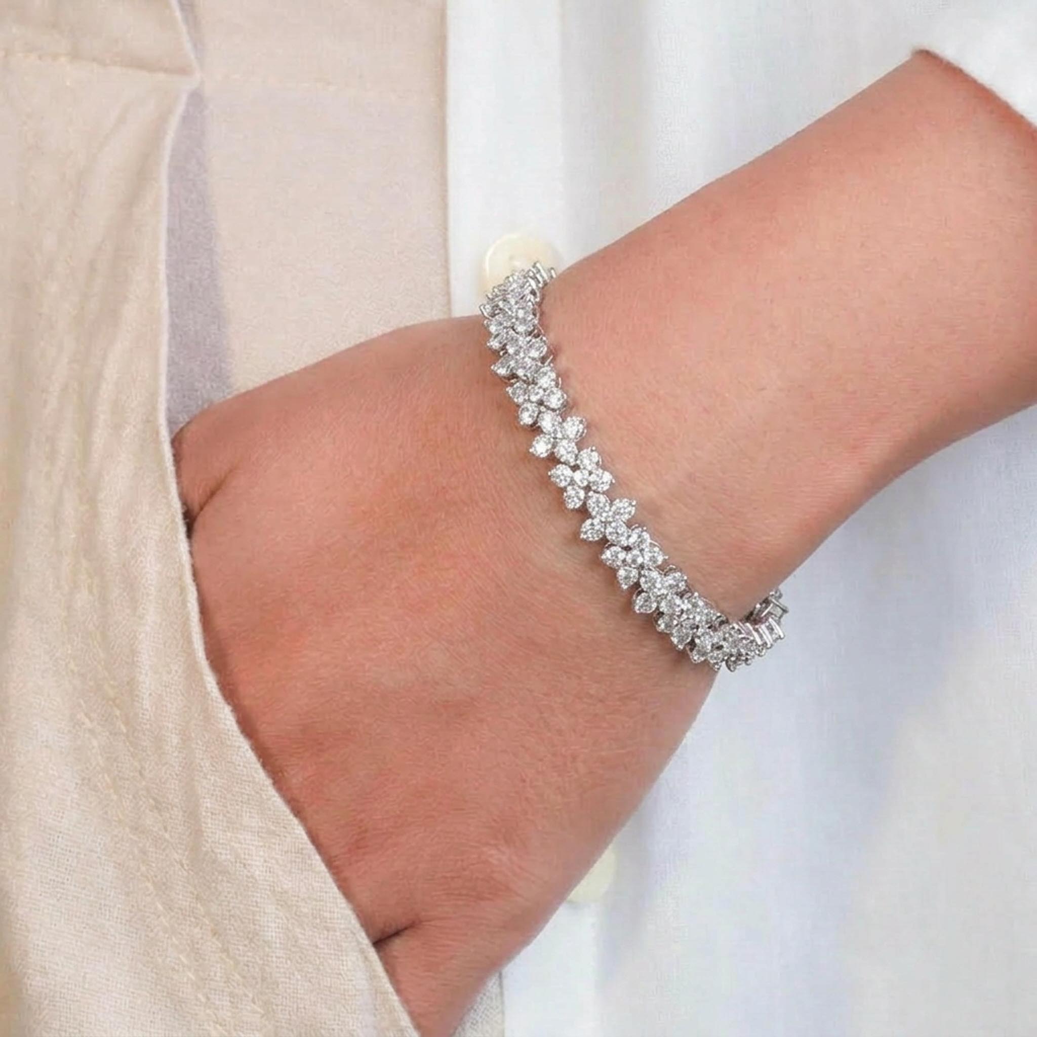 Butterfly Bloom 925 Sterling Silver Bracelet featuring a continuous row of sparkling butterfly-shaped links adorned with brilliant stones