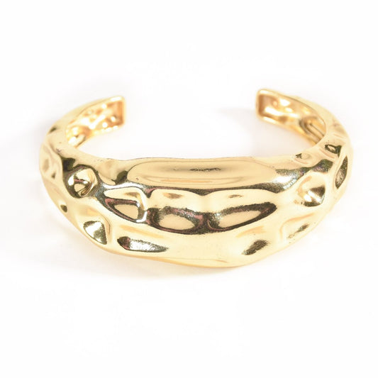Gold chunky abstract open cuff bangle with a hammered texture, anti-tarnish statement jewellery for women on a white background