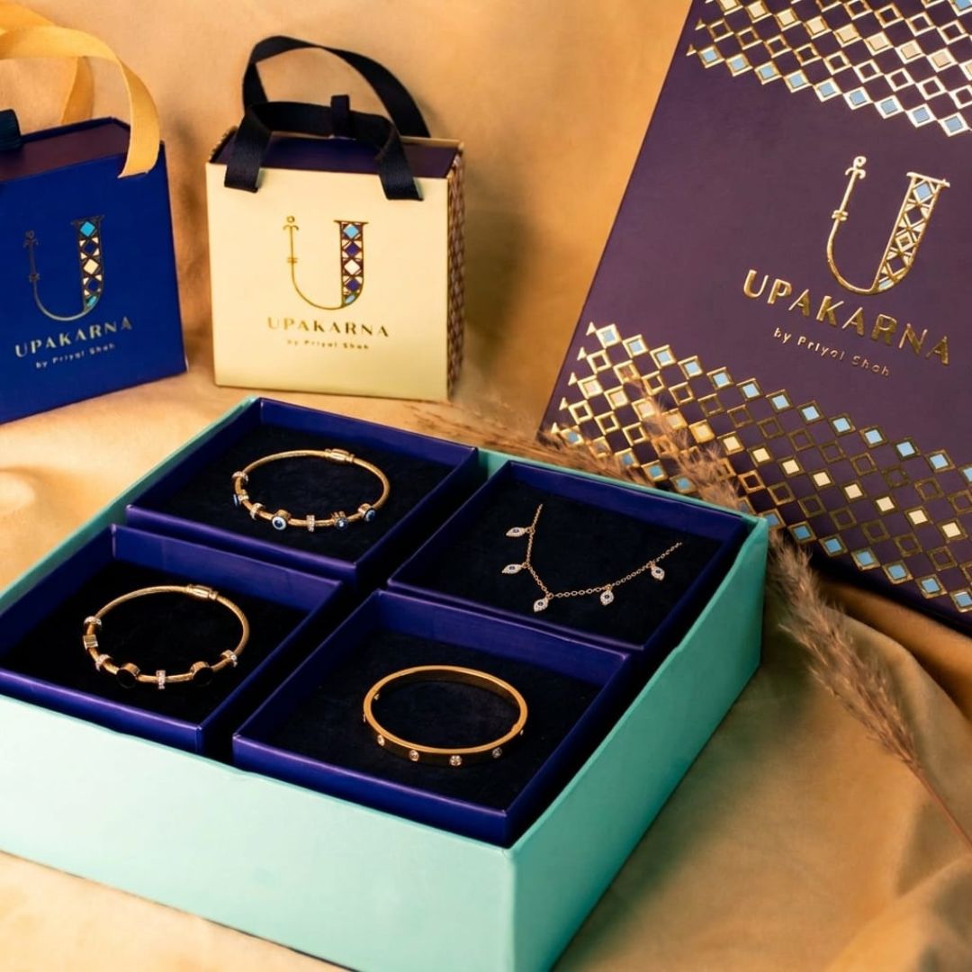 Classic Collection Gift Box featuring gold-tone evil eye bangles, stackable studded bangles, and a delicate mini evil eye choker for timeless everyday elegance.