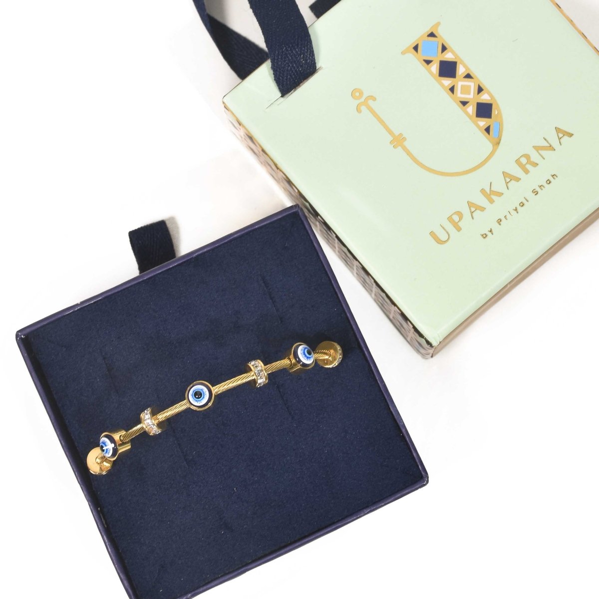 Classic evil eye bangle with a secure magnetic lock and anti-tarnish finish, available in gold, rose gold, and silver, perfect for everyday styling, meaningful gifting, and effortless stacking.
