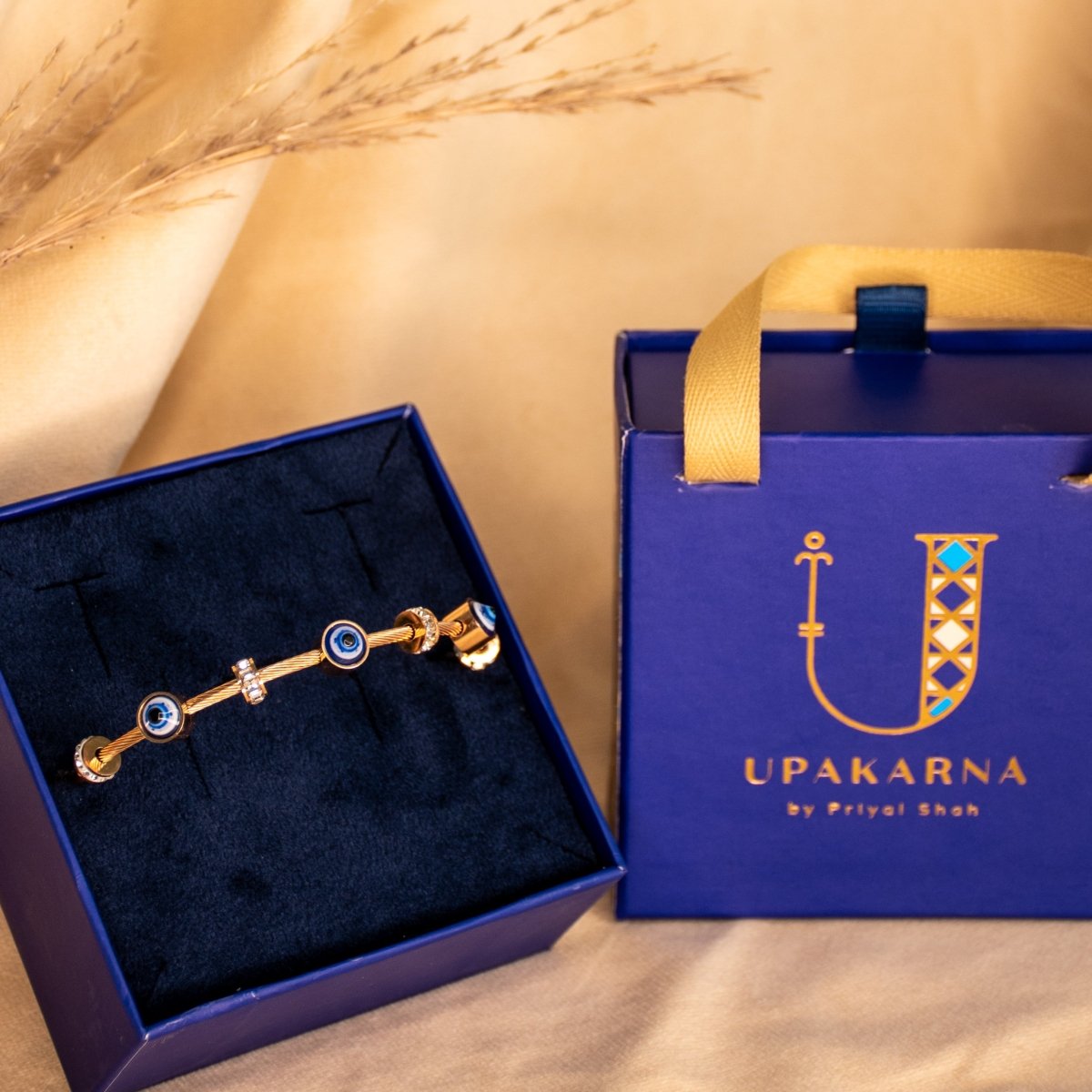 Classic evil eye bangle with a secure magnetic lock and anti-tarnish finish, available in gold, rose gold, and silver, perfect for everyday styling, meaningful gifting, and effortless stacking.
