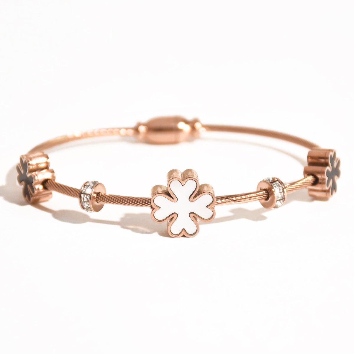 Elegant rose gold floral bangle with a dainty anti-tarnish finish and magnetic lock design, perfect for everyday wear, effortless stacking with bracelets, and timeless styling.