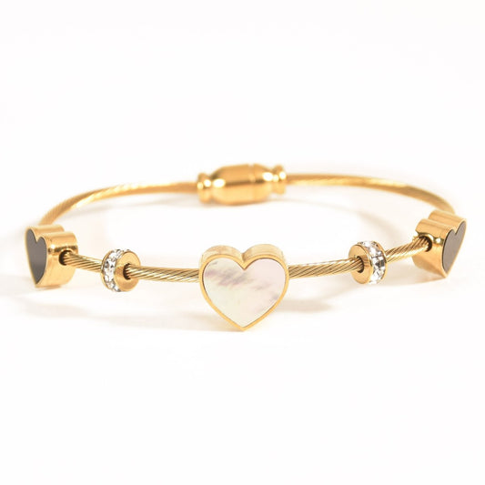 Elegant heart bangle with delicate heart detailing and an anti-tarnish finish, available in golden, silver, and rosegold, perfect for everyday elegance, parties, and thoughtful gifting.