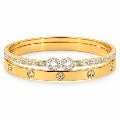 A set of two polished gold-toned bangles displayed together as a coordinated stack.