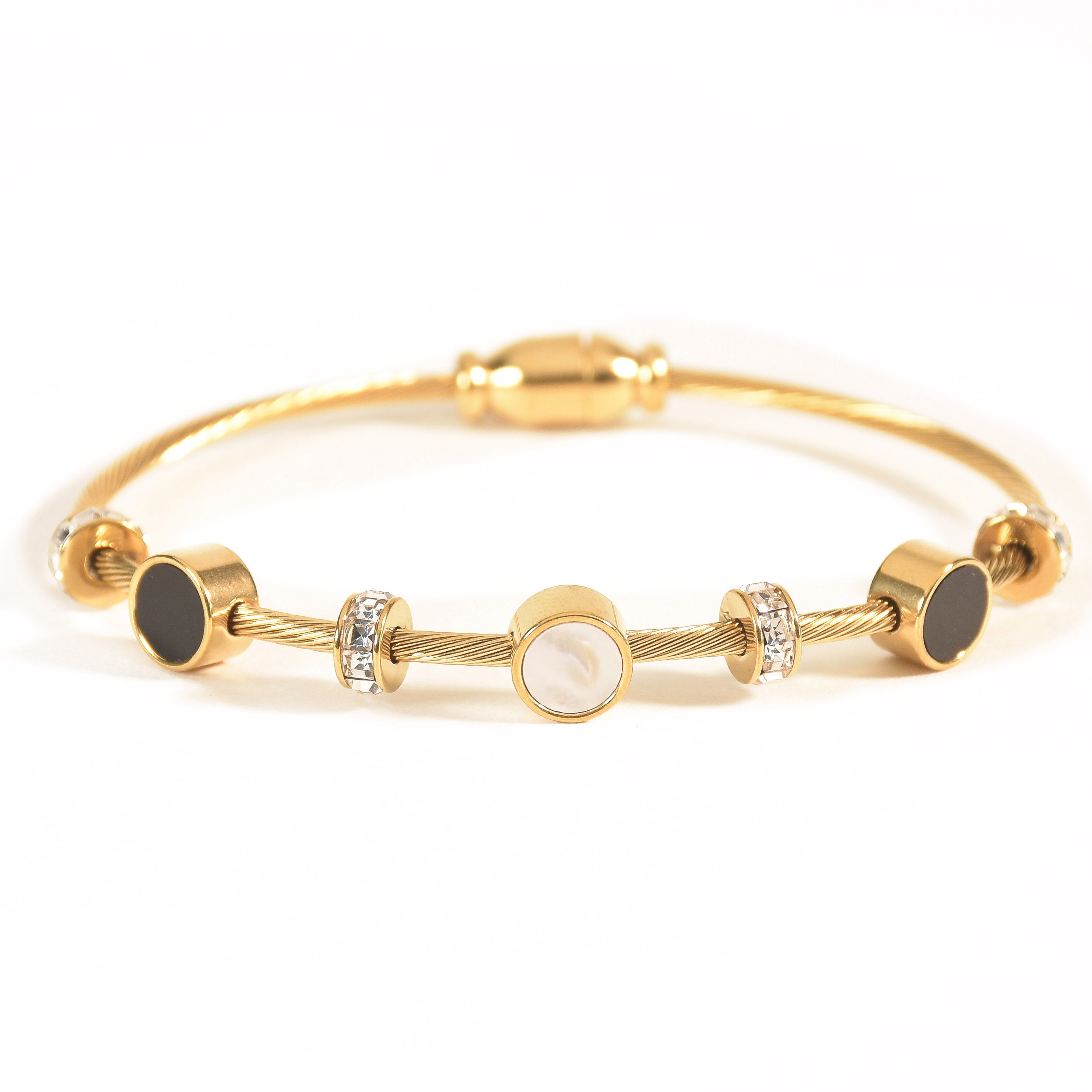 Gold bracelet with black and white mother of pearls in a magnetic lock